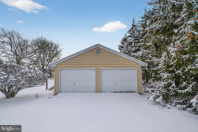 a view of garage and yard