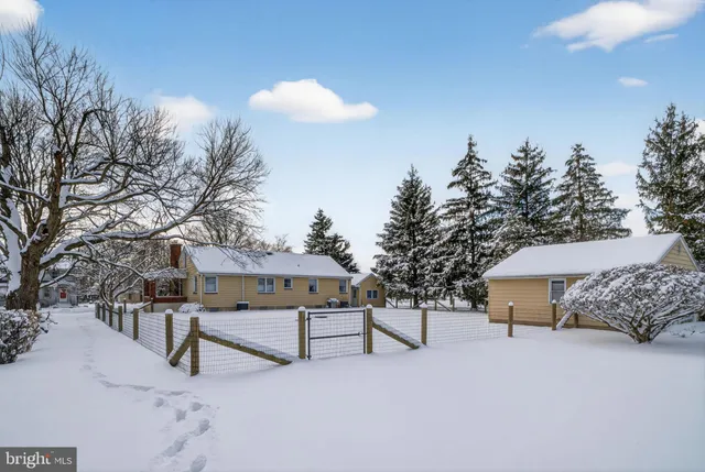a view of house with outdoor space and sitting area