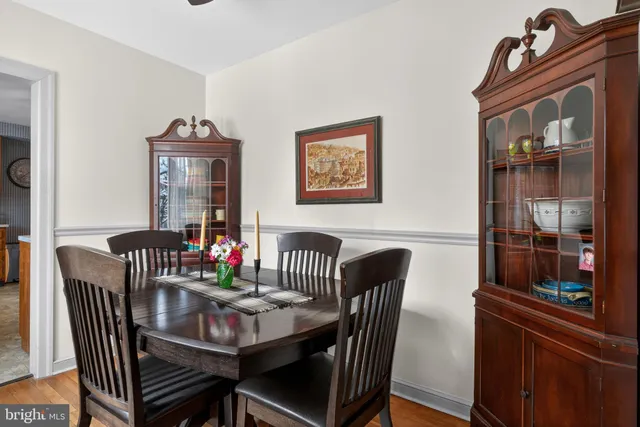 a view of a dining room with furniture and window