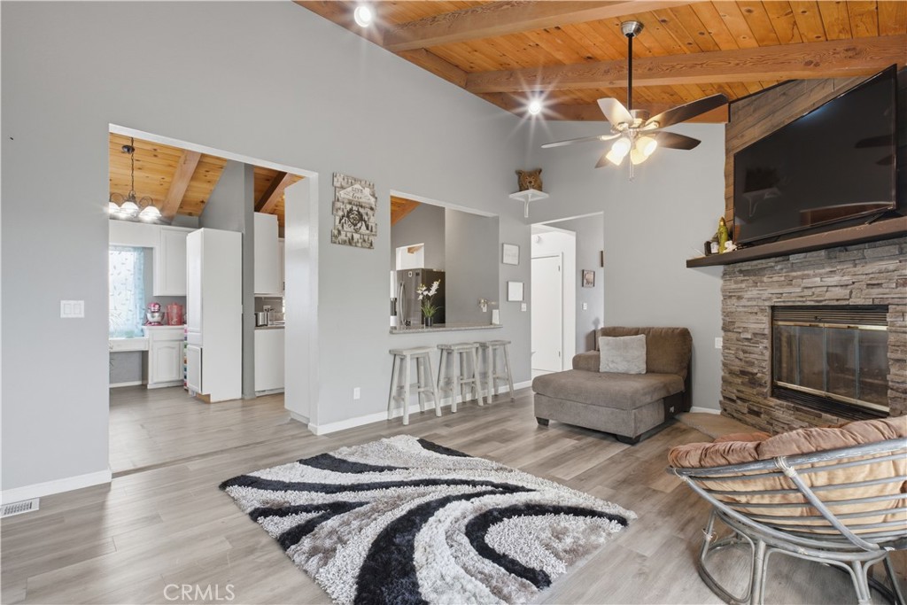 26201 Cumberland Road Tehachapi, CA 93561 - Photo 11 of 36 a bedroom with a bed a couch and a flat screen tv