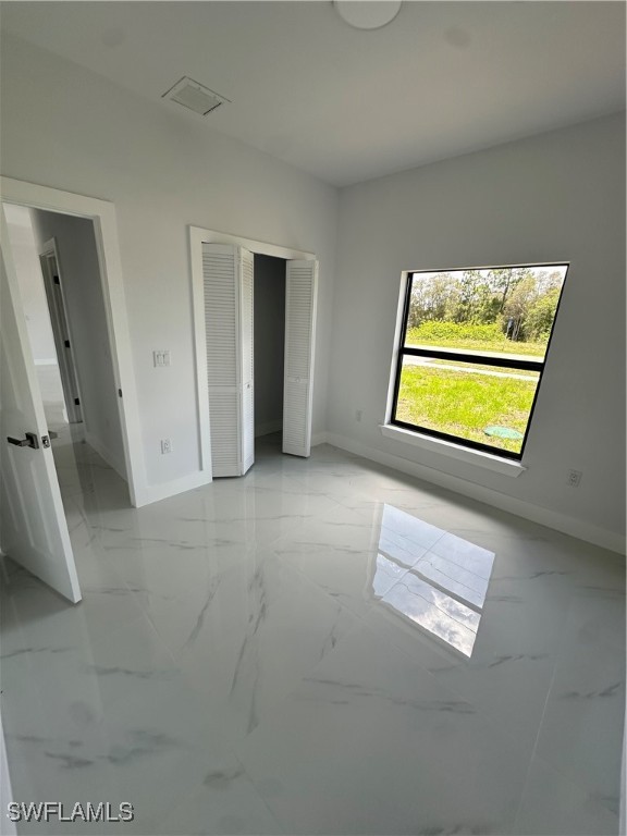 821 Bell Boulevard Lehigh Acres, FL 33974 - Photo 15 of 35 a view of a room with a window