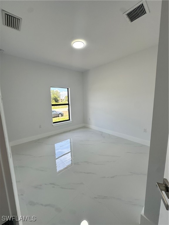 821 Bell Boulevard Lehigh Acres, FL 33974 - Photo 21 of 35 a view of a hallway with a window