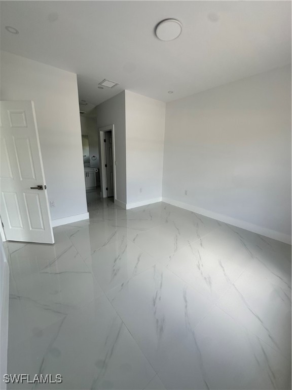821 Bell Boulevard Lehigh Acres, FL 33974 - Photo 27 of 35 wooden floor in an empty room