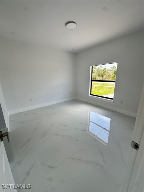 821 Bell Boulevard Lehigh Acres, FL 33974 - Photo 28 of 35 an empty room with windows