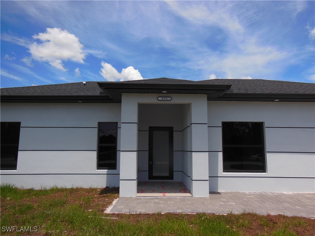 821 Bell Boulevard Lehigh Acres, FL 33974 - Photo 3 of 35 a view of a black garage