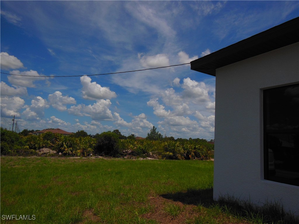 821 Bell Boulevard Lehigh Acres, FL 33974 - Photo 31 of 35 a view of a green field