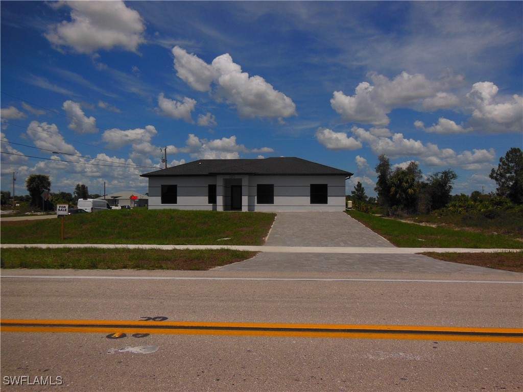 821 Bell Boulevard Lehigh Acres, FL 33974 - Photo 33 of 35 a view of house with yard