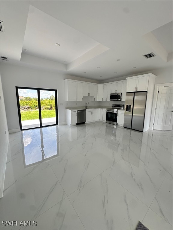 821 Bell Boulevard Lehigh Acres, FL 33974 - Photo 6 of 35 a view of kitchen with microwave and cabinets