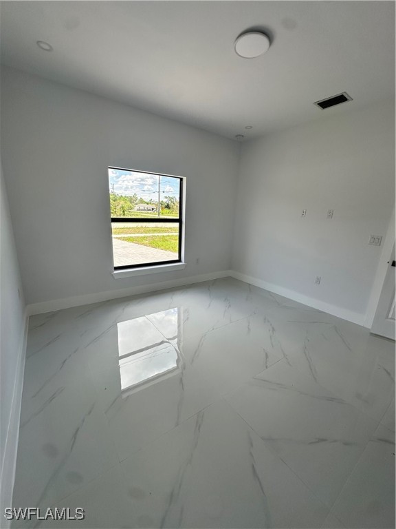 821 Bell Boulevard Lehigh Acres, FL 33974 - Photo 8 of 35 an empty room with a window