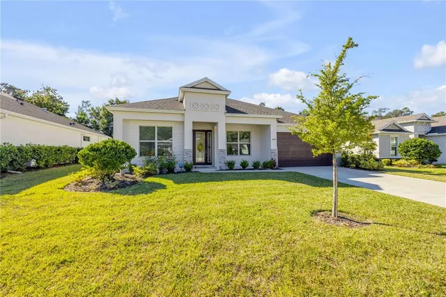 a house view with swimming pool and garden