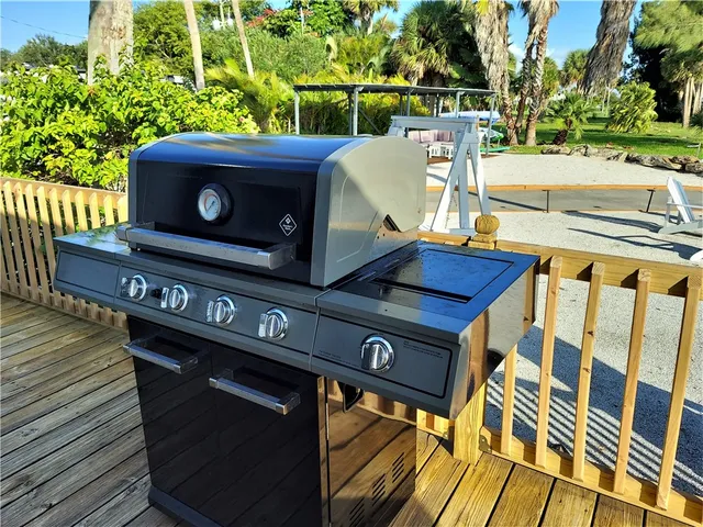 a view of a chairs and table on the deck