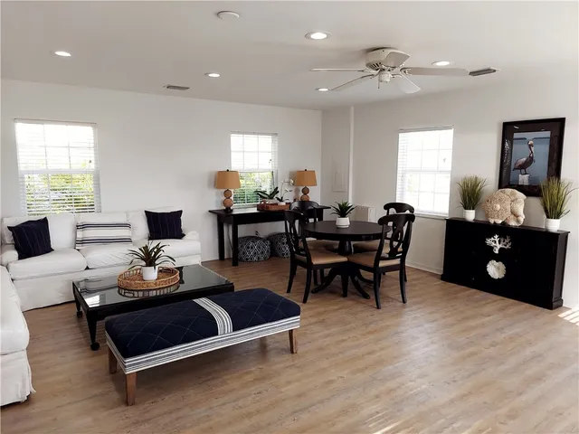 a living room with furniture rug and window