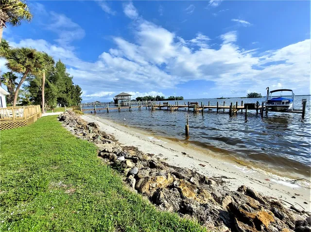 a view of a lake with a yard