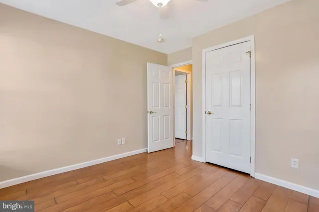 a view of an empty room and wooden floor