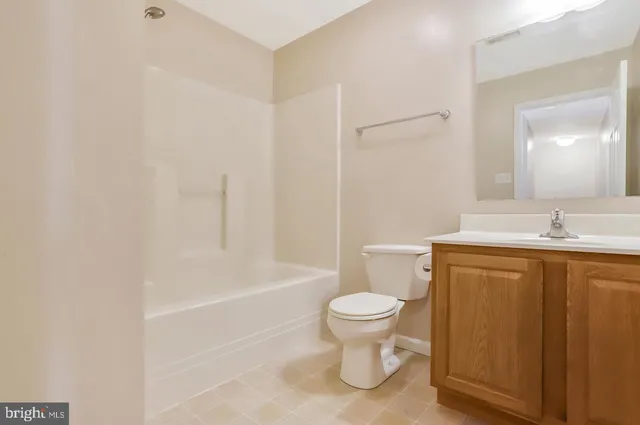 a bathroom with a sink a toilet and a bathtub