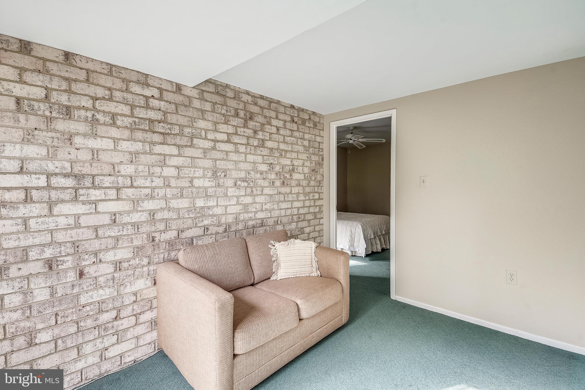 10026 Stedwick Road, Unit 301 Gaithersburg, MD 20886 - Photo 12 of 24 COZY DEN WITH BRICK WALL