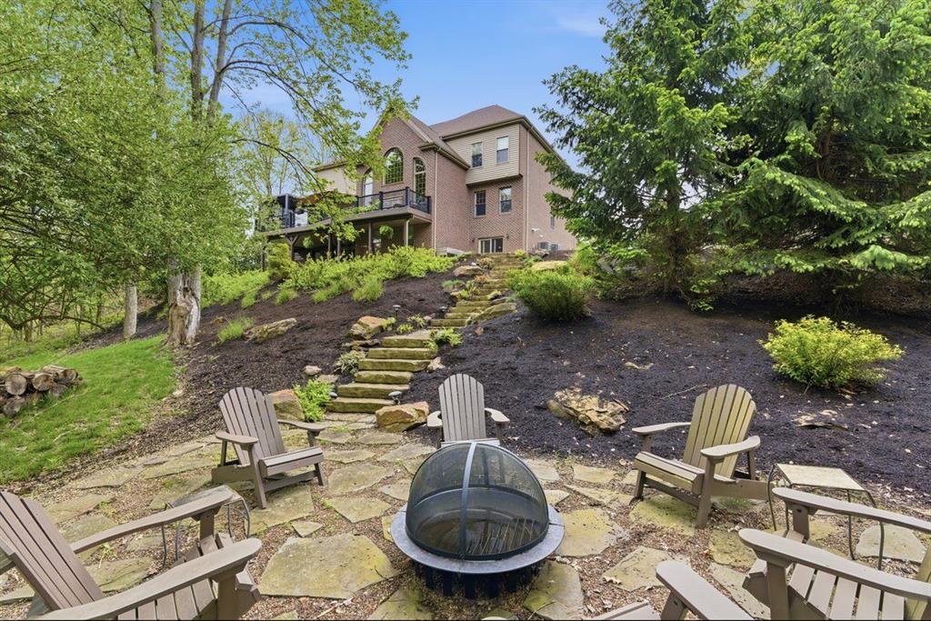 24 South Cowan Road Carnegie, PA 15106 - Photo 35 of 40 a backyard of a house with table and chairs