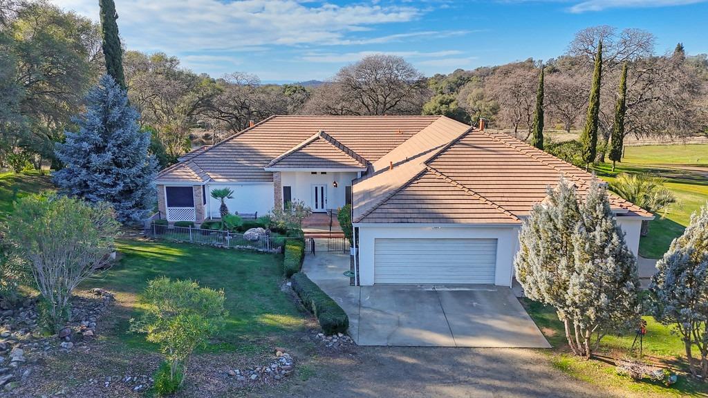 4560 Shingle Lime Mine Road Shingle Springs, CA 95682 - Photo 1 of 1 a front view of a house with a yard and garage