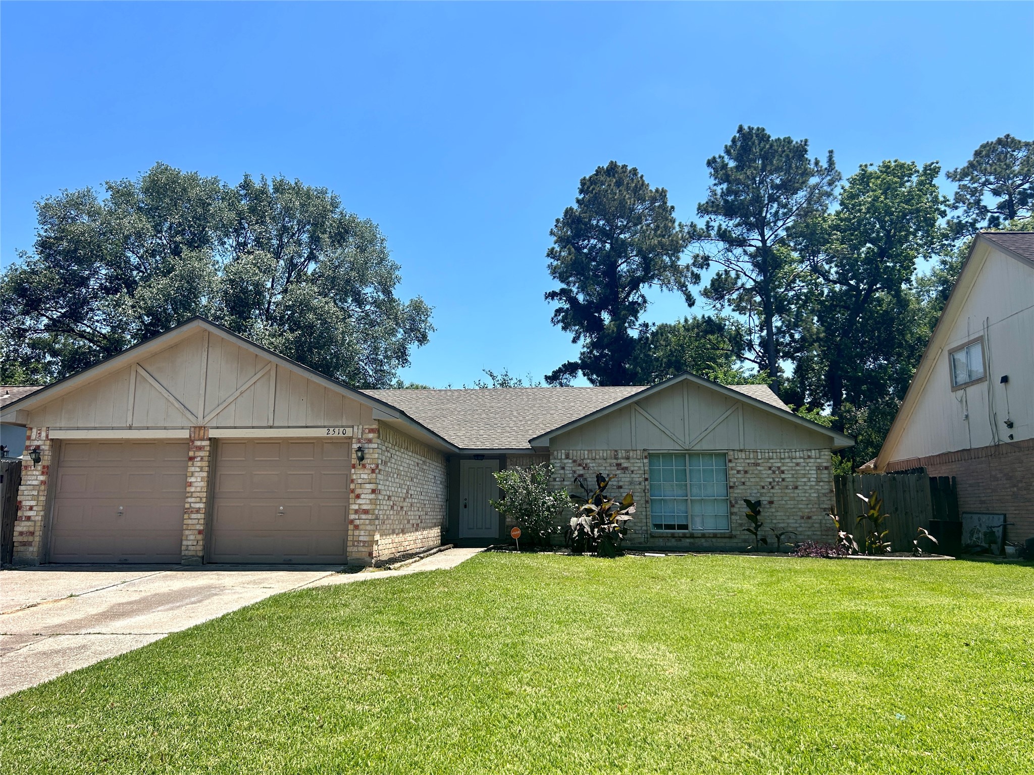 2510 Knollbrook Lane Spring, TX 77373 - Photo 1 of 24 a front view of a house with a yard and garage