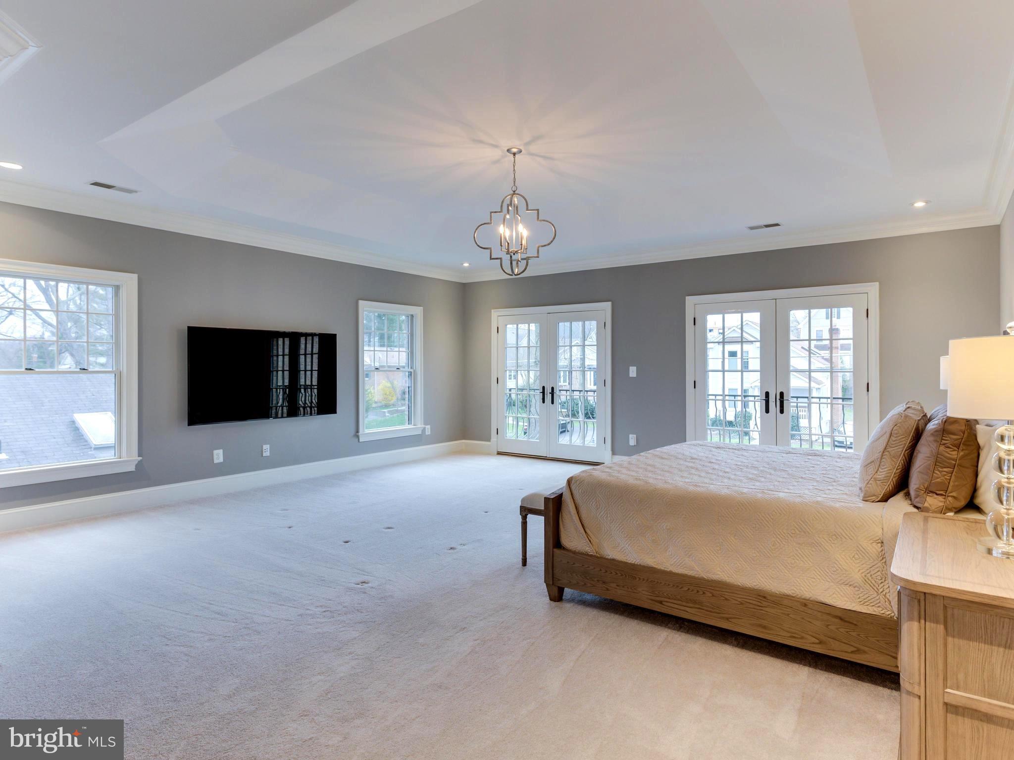 6906 Chelsea Road McLean, VA 22101 - Photo 16 of 25 a bedroom with a large bed and a window