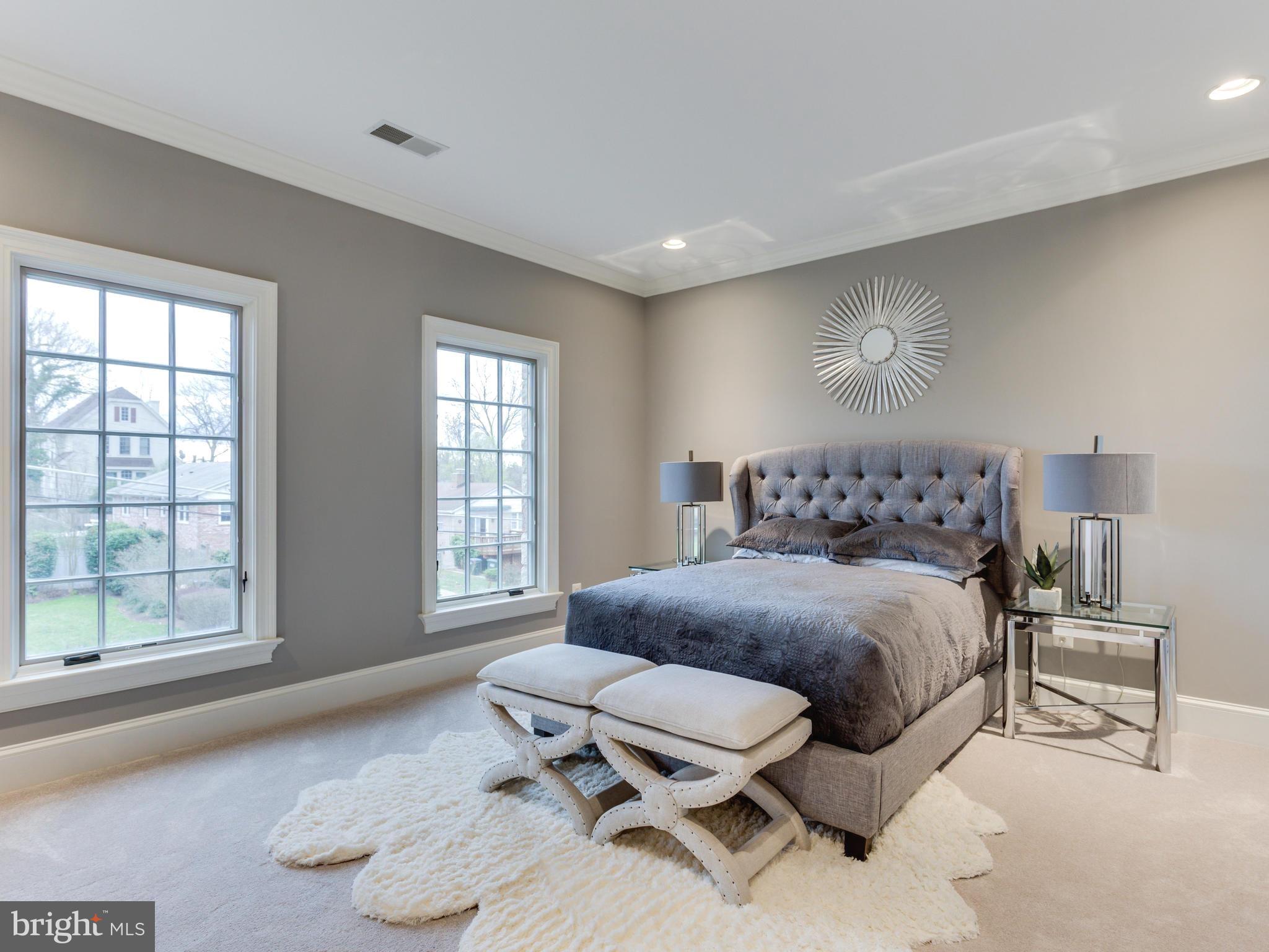 6906 Chelsea Road McLean, VA 22101 - Photo 20 of 25 a bedroom with a bed and wooden floor