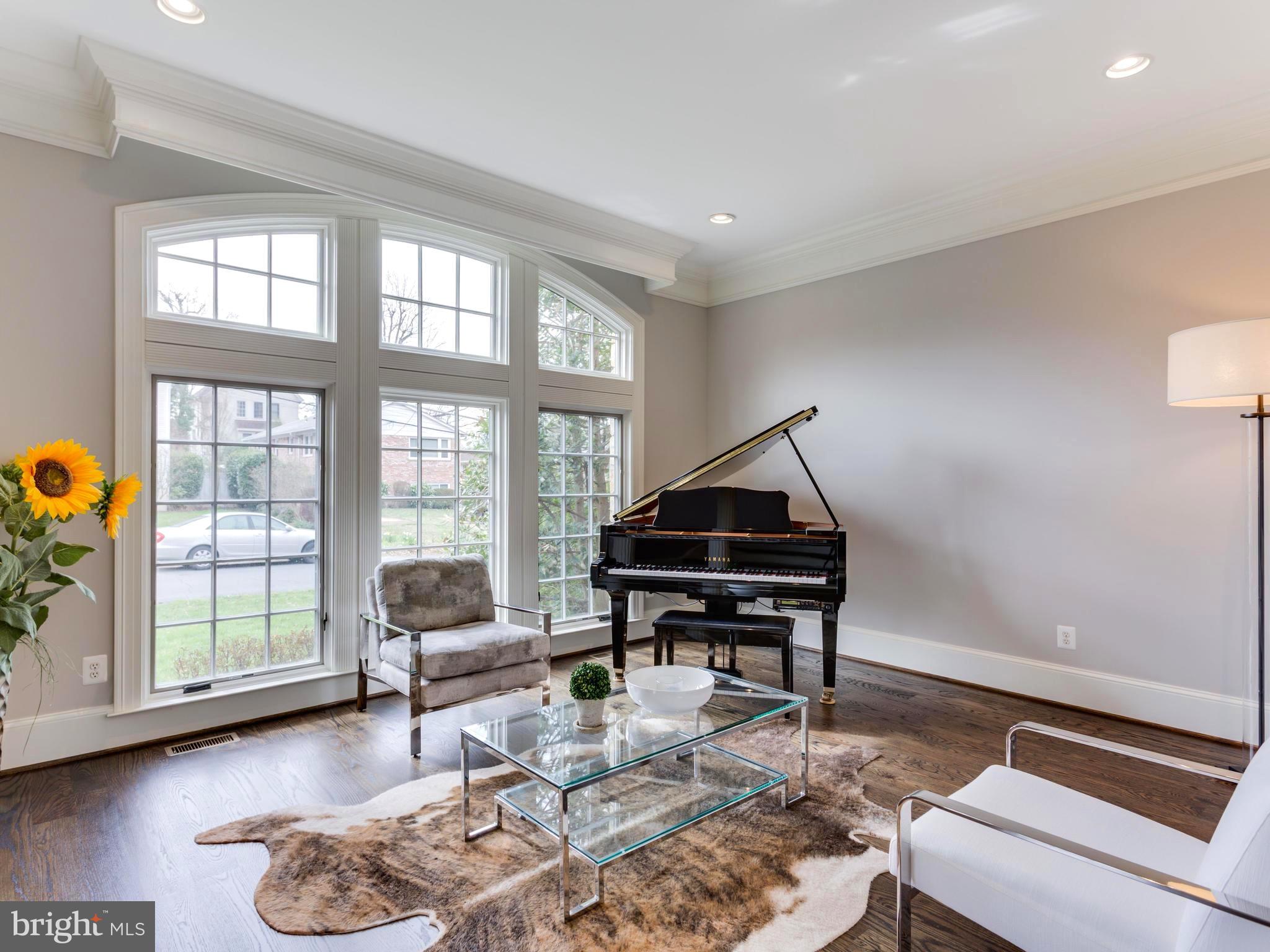 6906 Chelsea Road McLean, VA 22101 - Photo 3 of 25 a living room with furniture a rug and a window