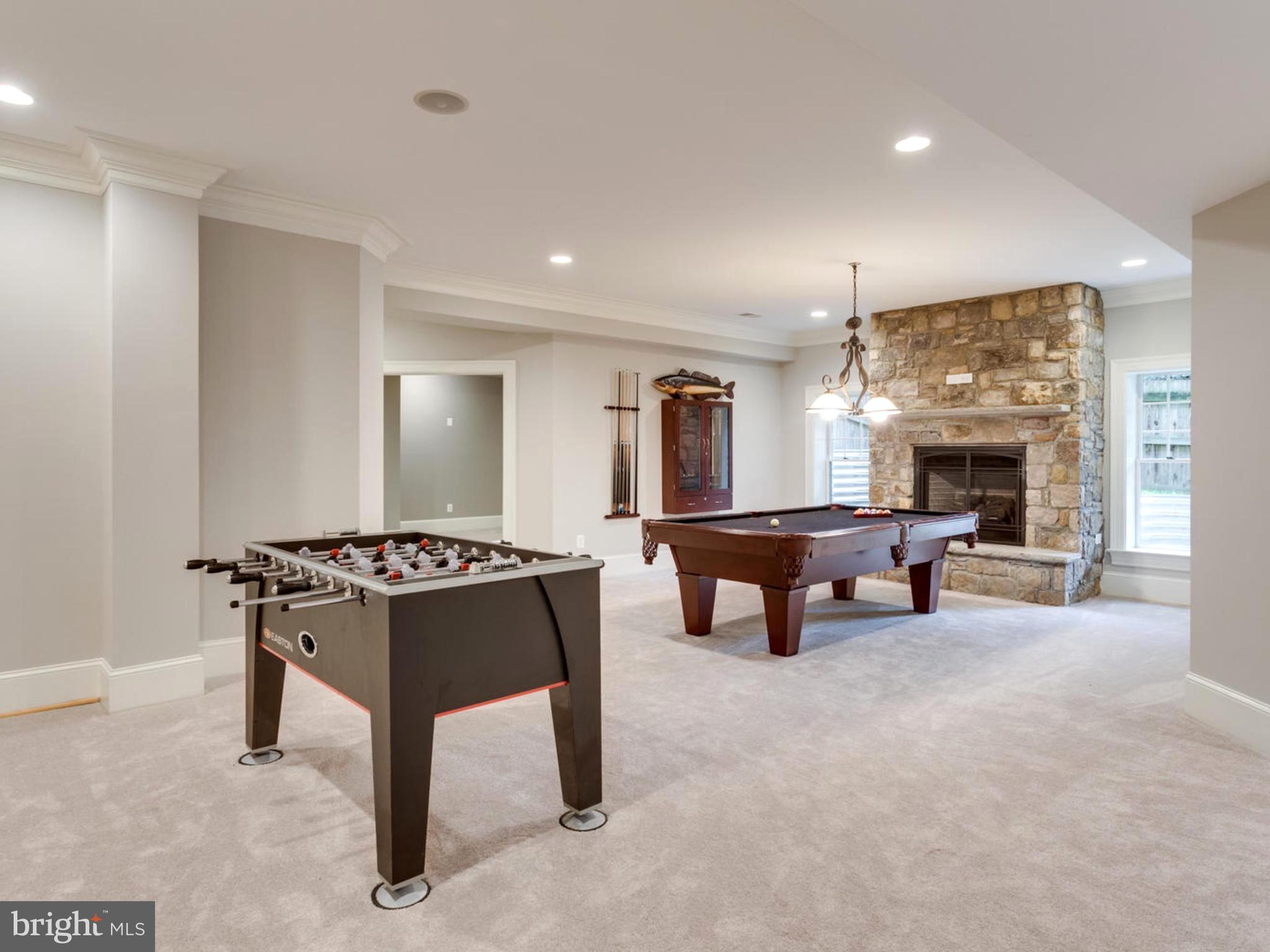 6906 Chelsea Road McLean, VA 22101 - Photo 23 of 25 a living room with furniture and a fireplace