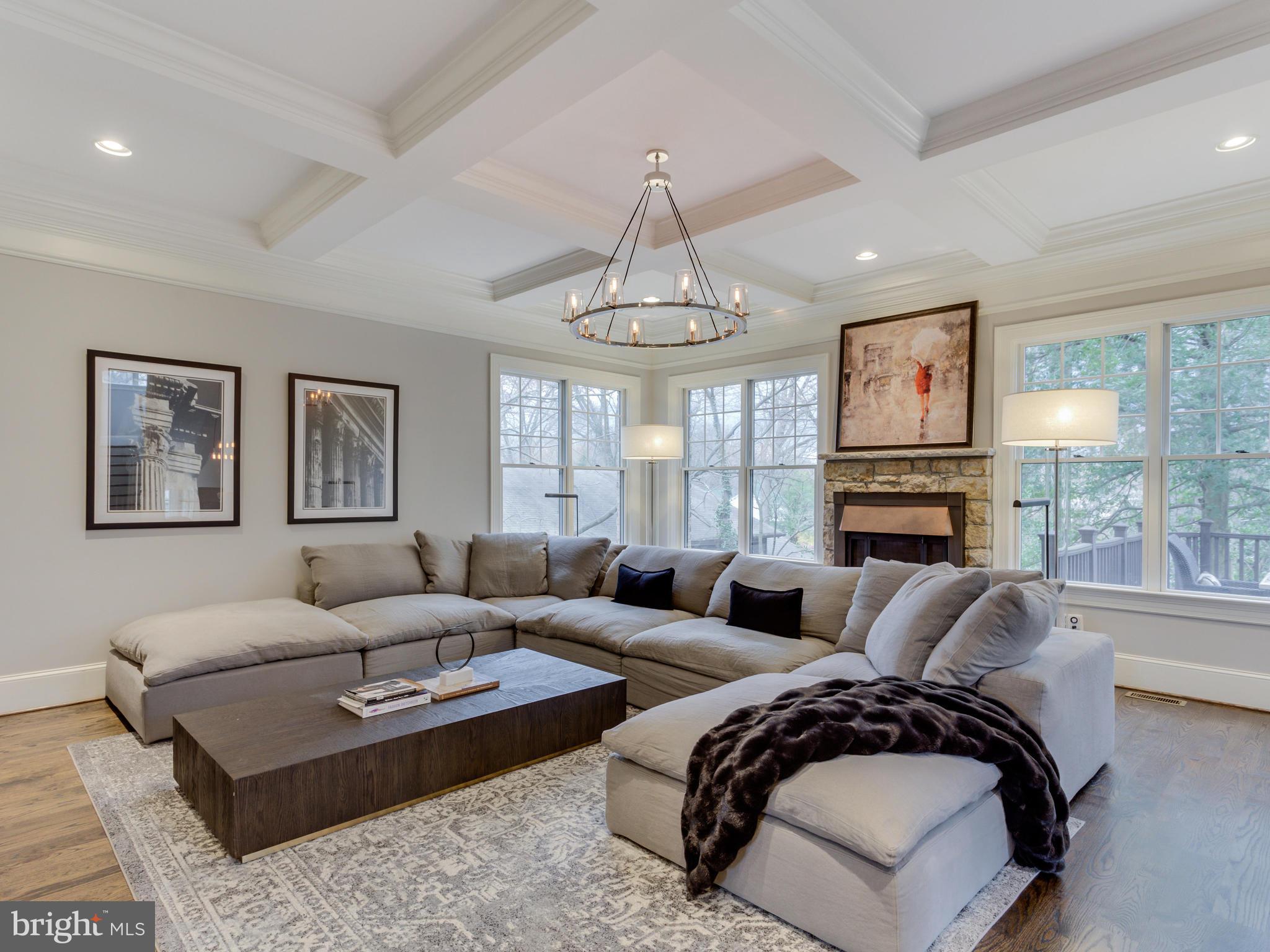 6906 Chelsea Road McLean, VA 22101 - Photo 6 of 25 a living room with furniture a large window and a chandelier