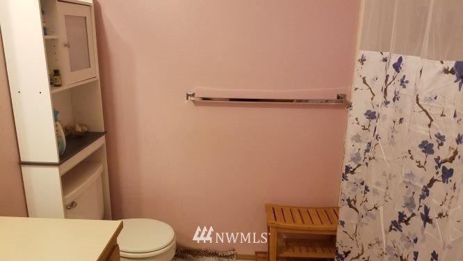 809 234th Street Southeast Bothell, WA 98021 - Photo 10 of 11 a bathroom with a toilet and a shower curtain