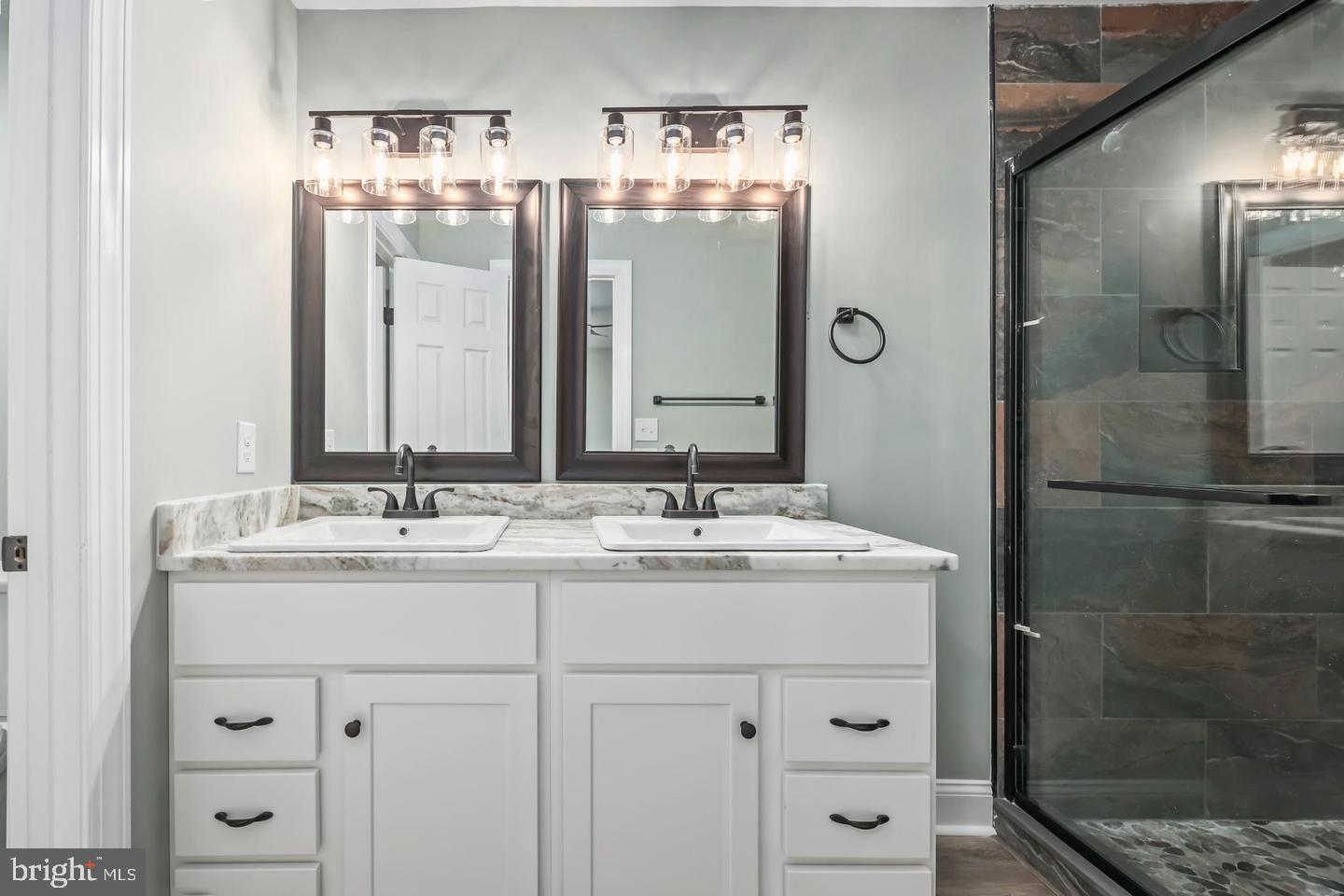 2755 Sunnybank Road Reedville, VA 22539 - Photo 26 of 57 Elegant dual vanity with modern fixtures.