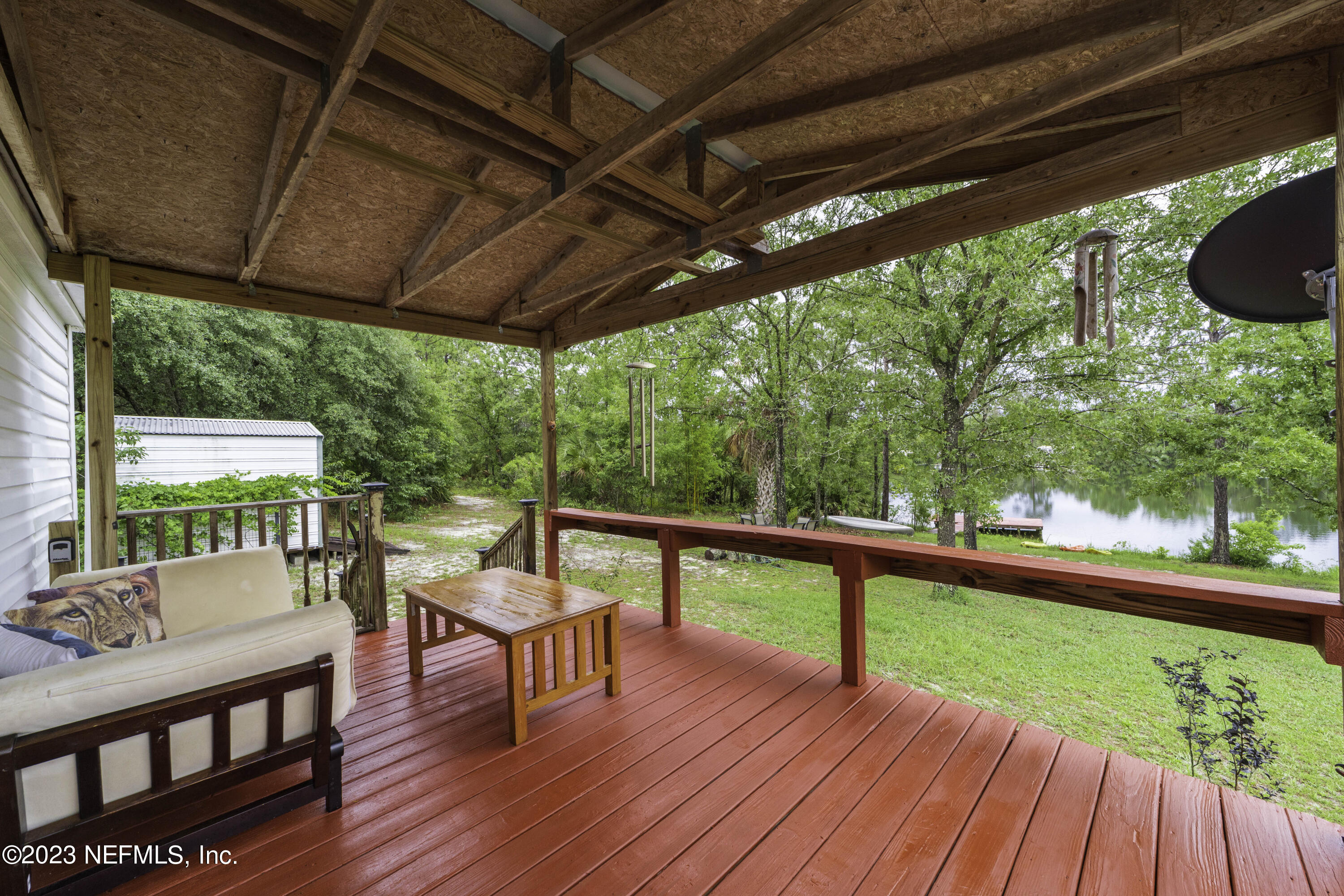 103 Long Branch Court Interlachen, FL 32148 - Photo 1 of 54 a view of a patio with wooden floor
