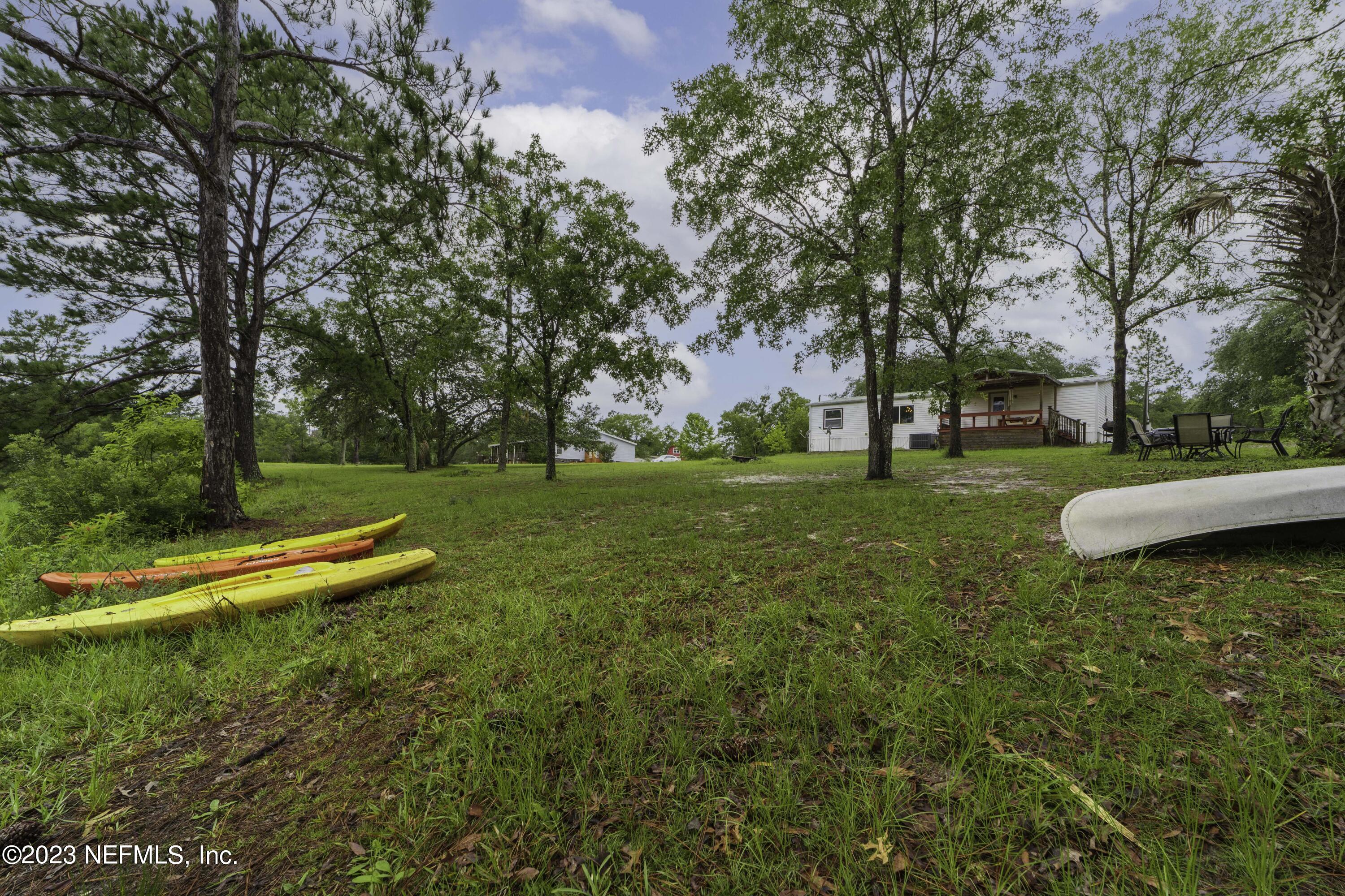 103 Long Branch Court Interlachen, FL 32148 - Photo 13 of 54 a view of a park with large trees