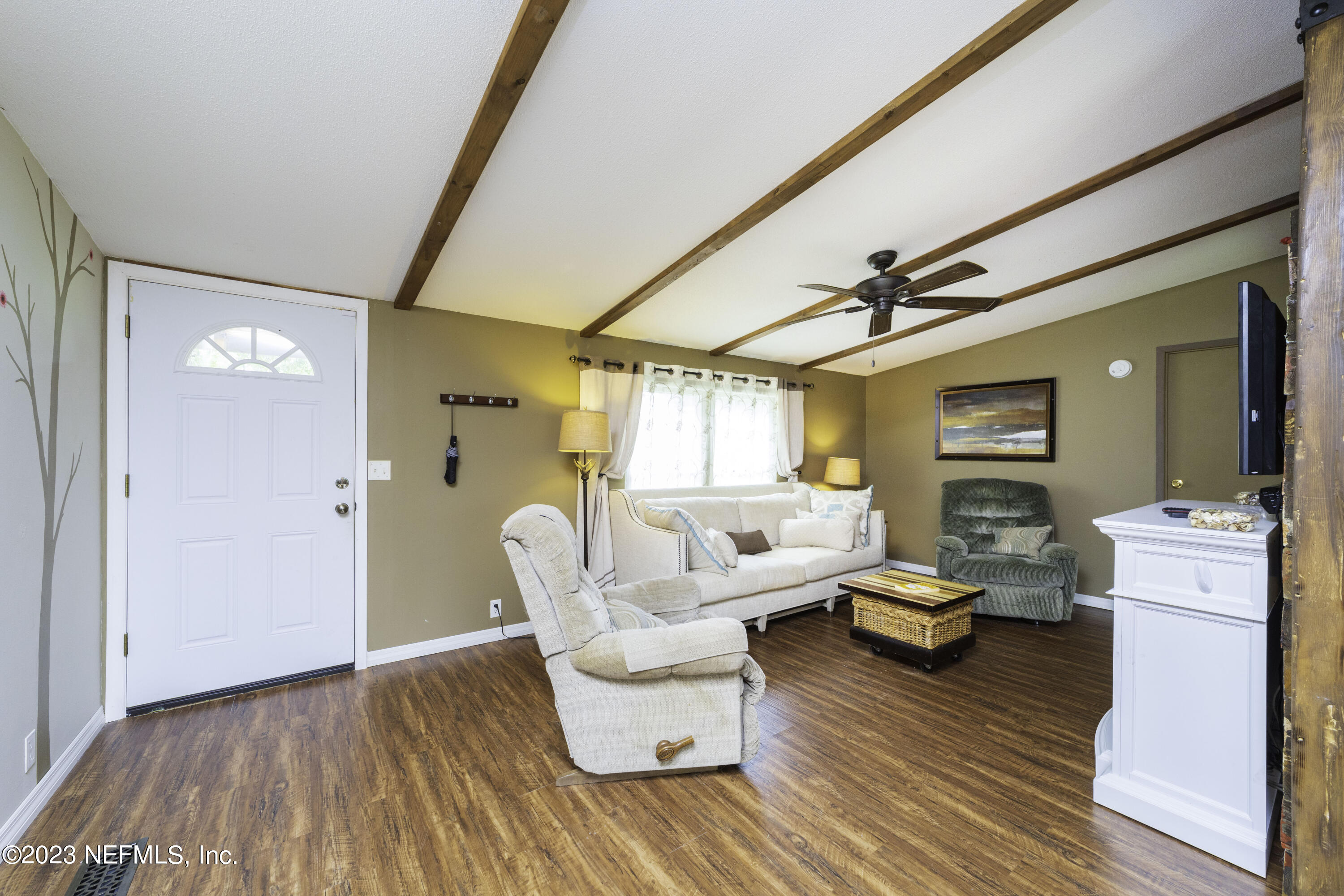 103 Long Branch Court Interlachen, FL 32148 - Photo 17 of 54 a living room with furniture and a wooden floor