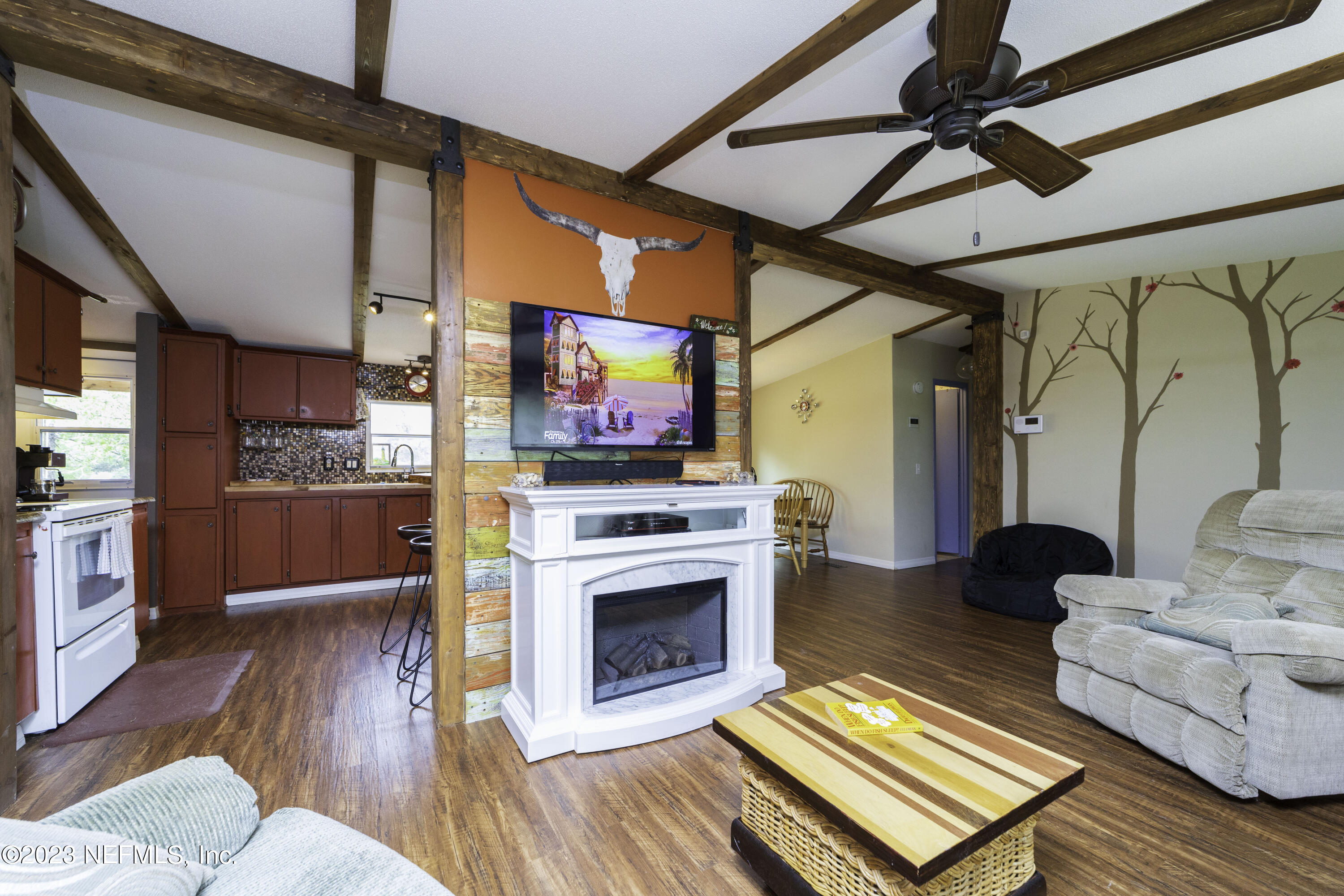 103 Long Branch Court Interlachen, FL 32148 - Photo 27 of 54 a living room with furniture and a fireplace