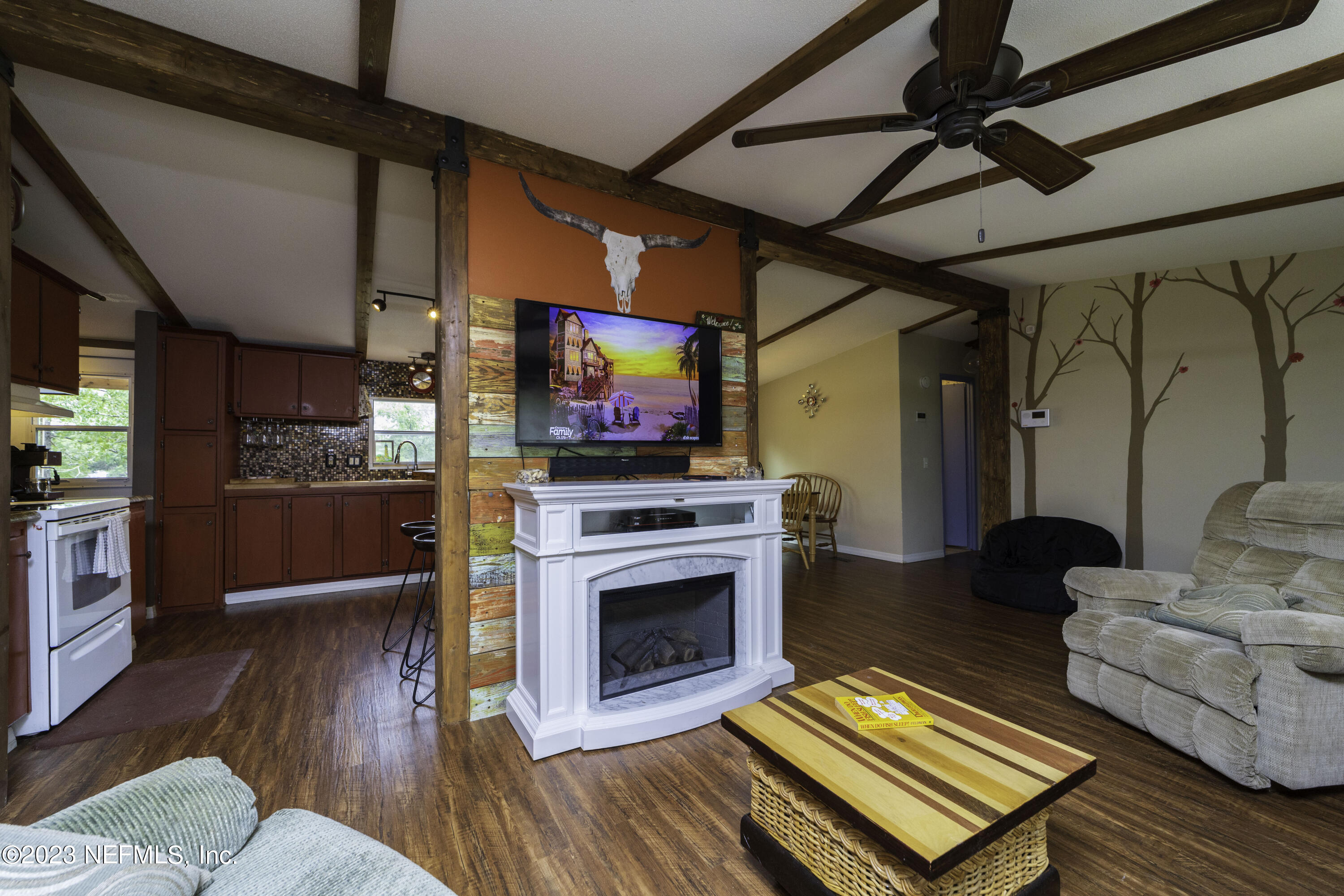103 Long Branch Court Interlachen, FL 32148 - Photo 29 of 54 a living room with furniture fireplace and flat screen tv