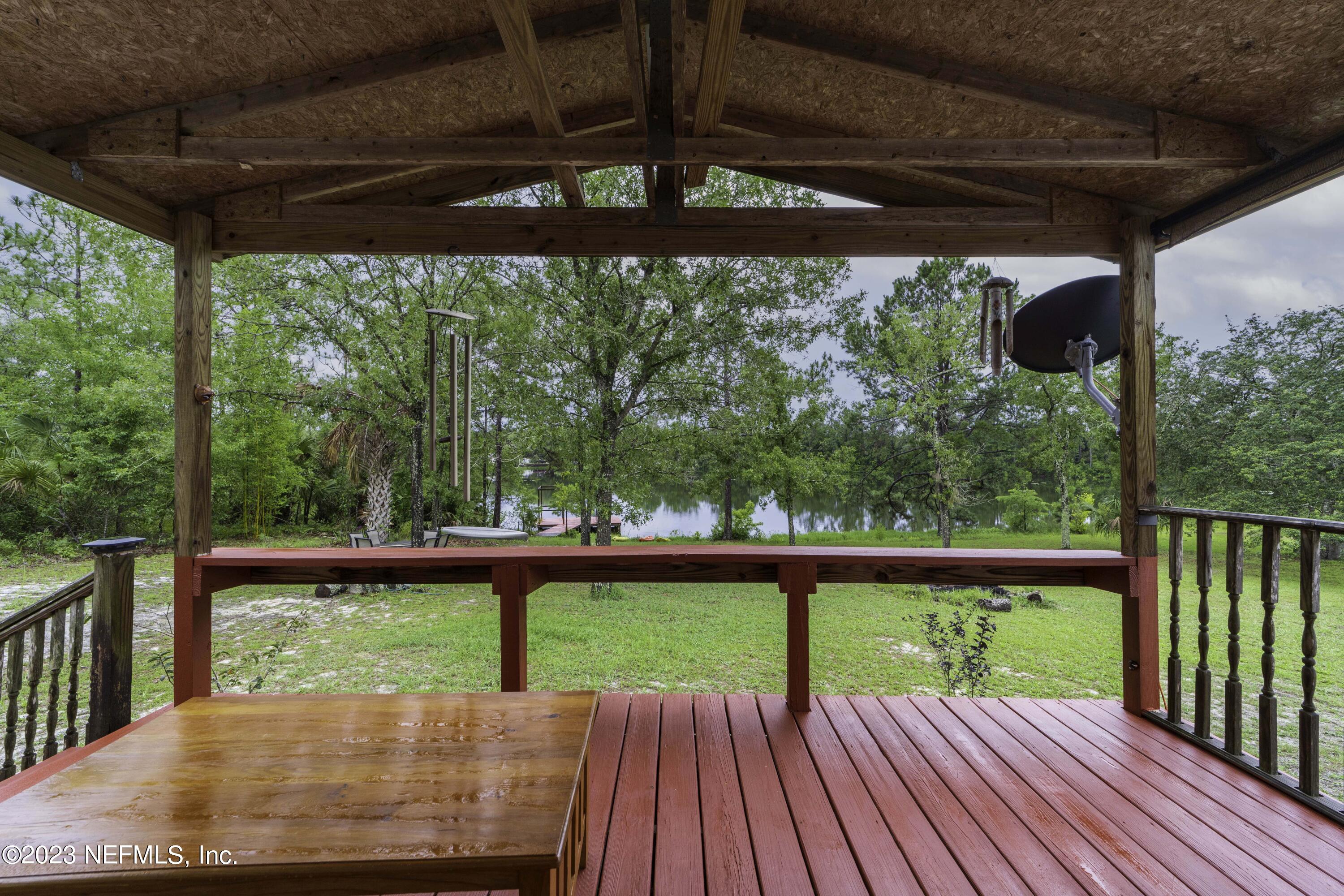 103 Long Branch Court Interlachen, FL 32148 - Photo 33 of 54 a view of a porch with wooden floor in outdoor space