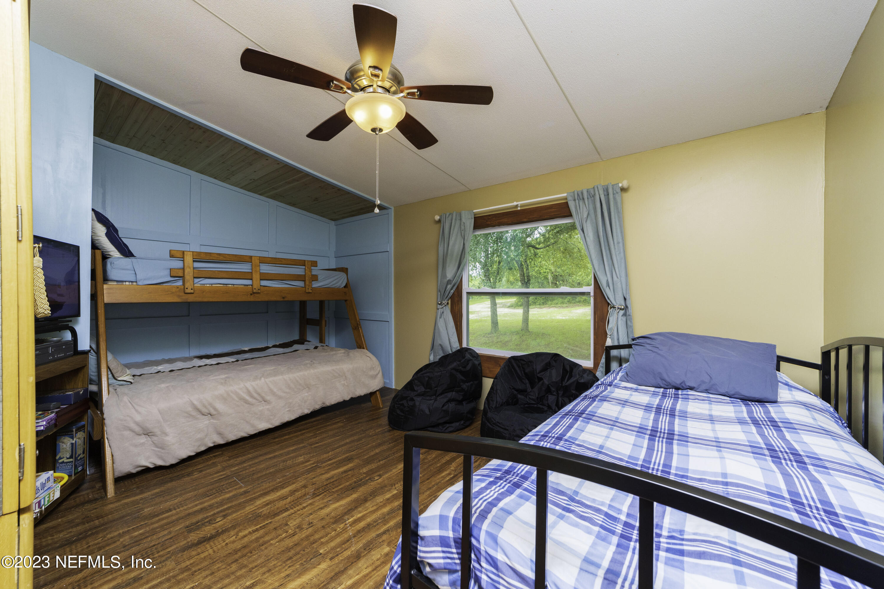 103 Long Branch Court Interlachen, FL 32148 - Photo 35 of 54 a bedroom with furniture and a window