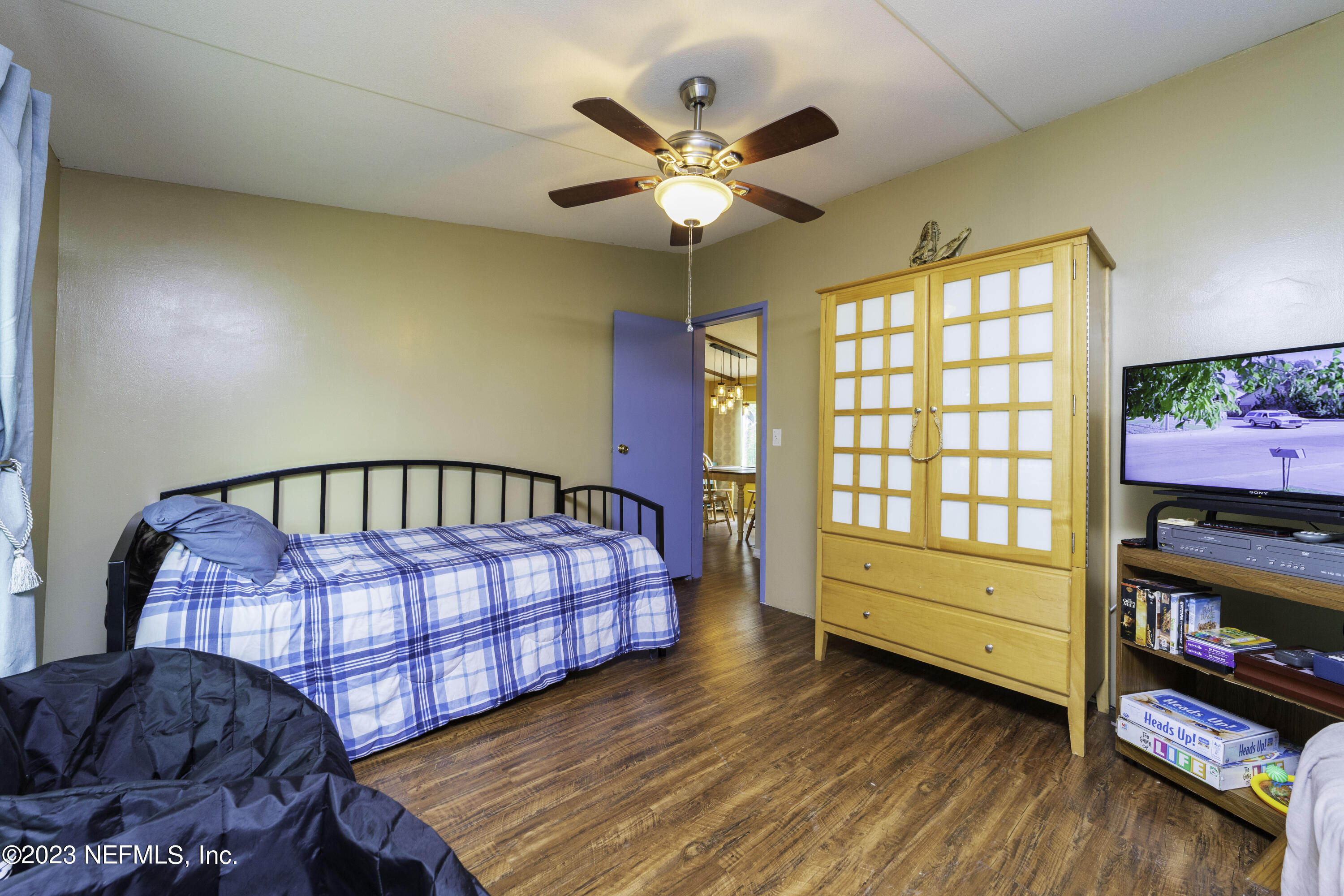 103 Long Branch Court Interlachen, FL 32148 - Photo 36 of 54 a living room with baby crib furniture and a window