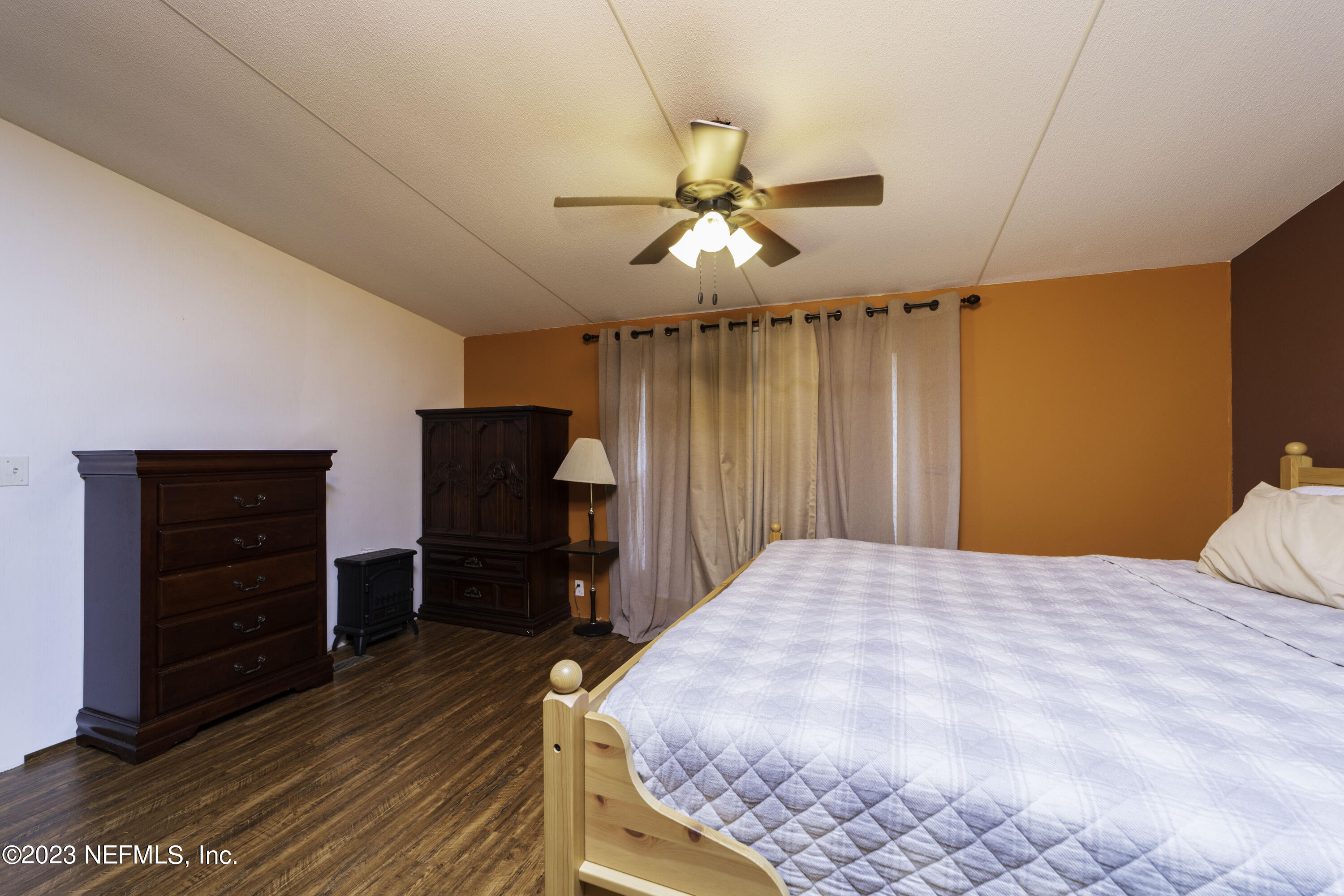 103 Long Branch Court Interlachen, FL 32148 - Photo 44 of 54 a bedroom with a bed and furniture