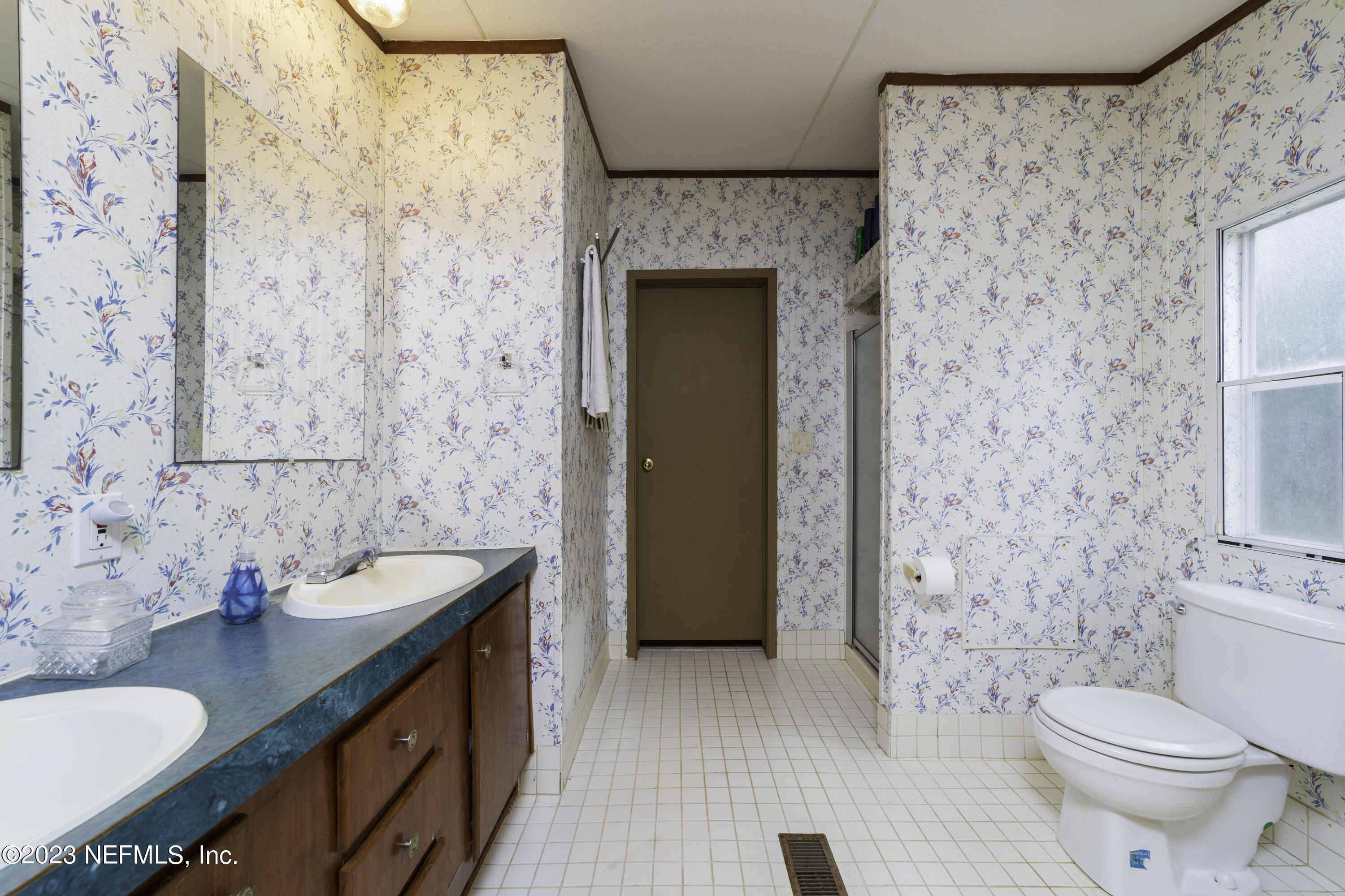 103 Long Branch Court Interlachen, FL 32148 - Photo 48 of 54 a bathroom with a granite countertop sink toilet and shower