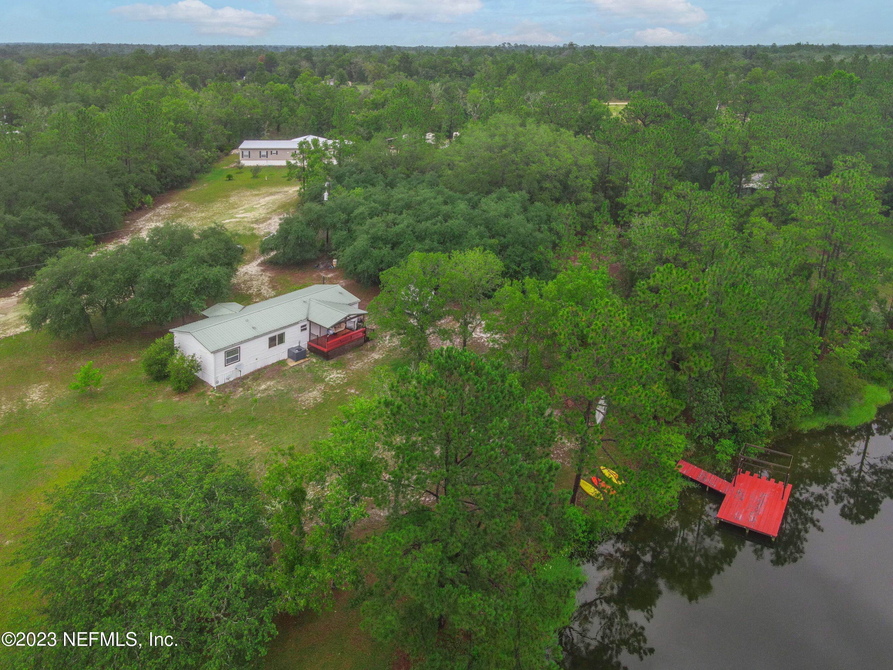 103 Long Branch Court Interlachen, FL 32148 - Photo 5 of 54 a aerial view of a house with a yard