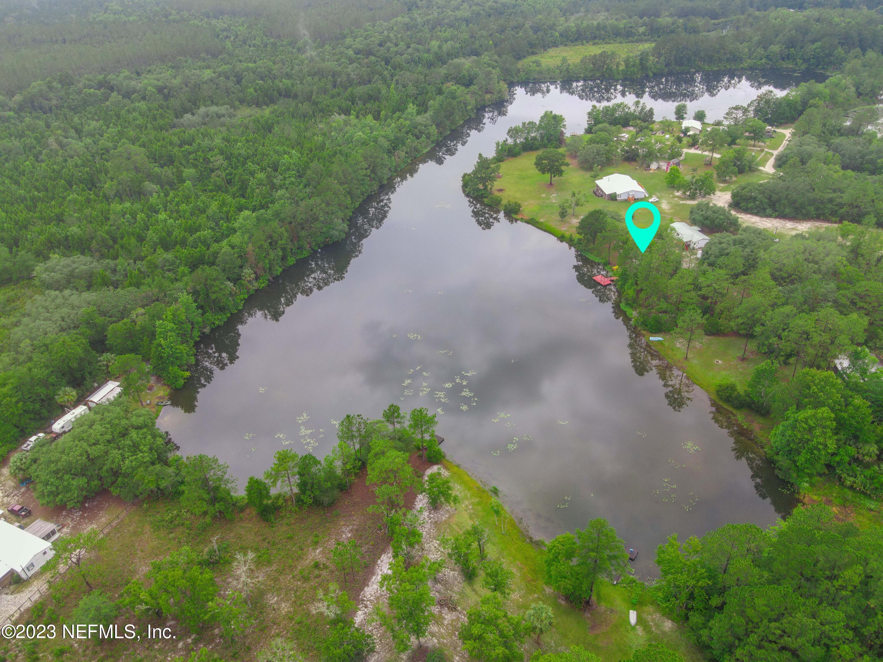 103 Long Branch Court Interlachen, FL 32148 - Photo 53 of 54 a view of a lake with a yard