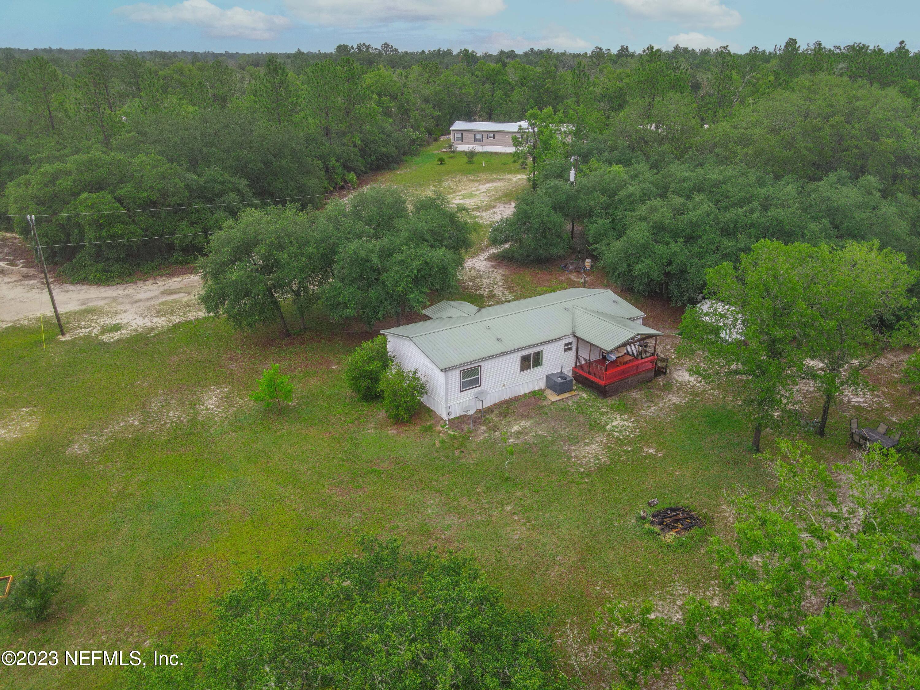 103 Long Branch Court Interlachen, FL 32148 - Photo 54 of 54 a aerial view of residential houses with outdoor space and trees