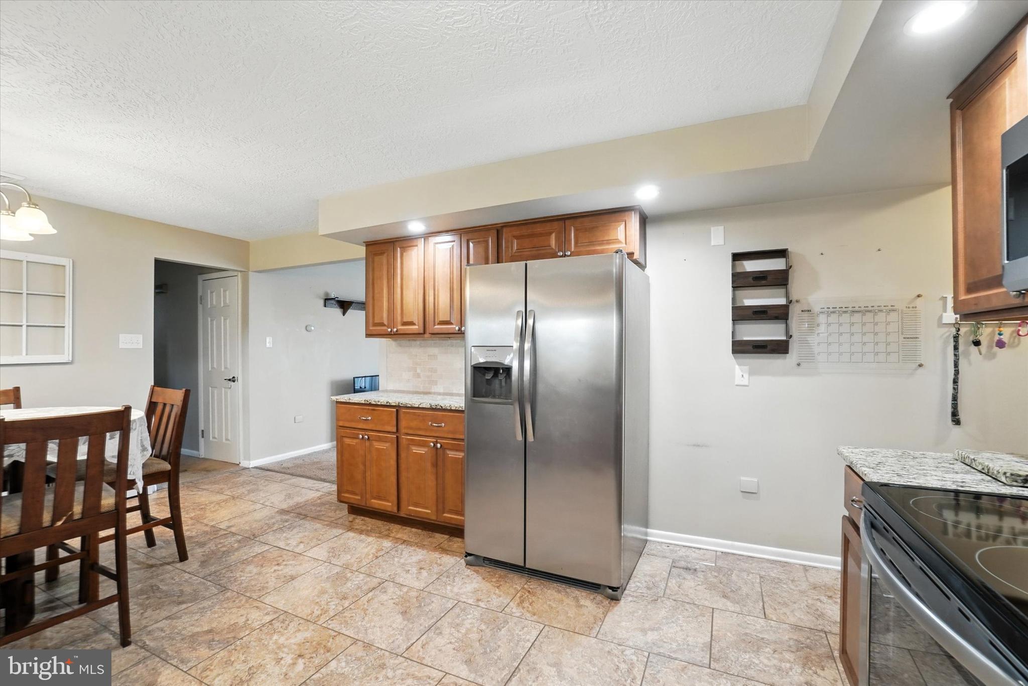 838 Delta Road Red Lion, PA 17356 - Photo 6 of 28 a kitchen with stainless steel appliances granite countertop a refrigerator and a stove top oven