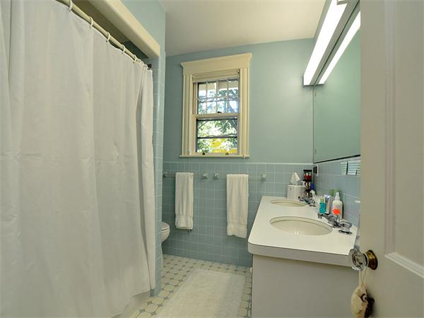 14 Amory Street Brookline, MA 02446 - Photo 15 of 25 a bathroom with a sink and a mirror