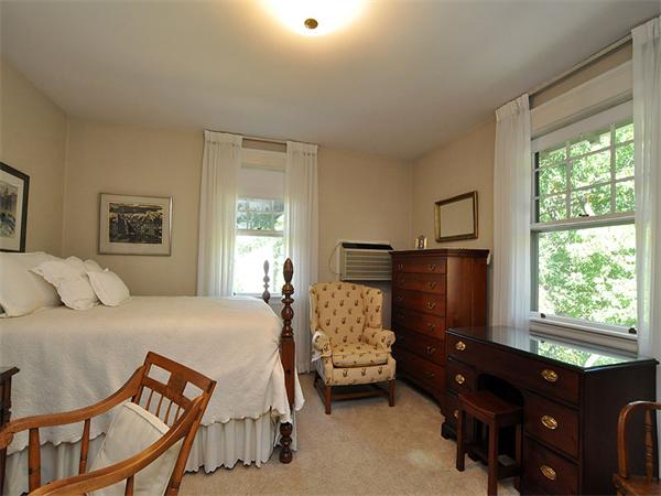 14 Amory Street Brookline, MA 02446 - Photo 16 of 25 a bedroom with a bed and wooden floor