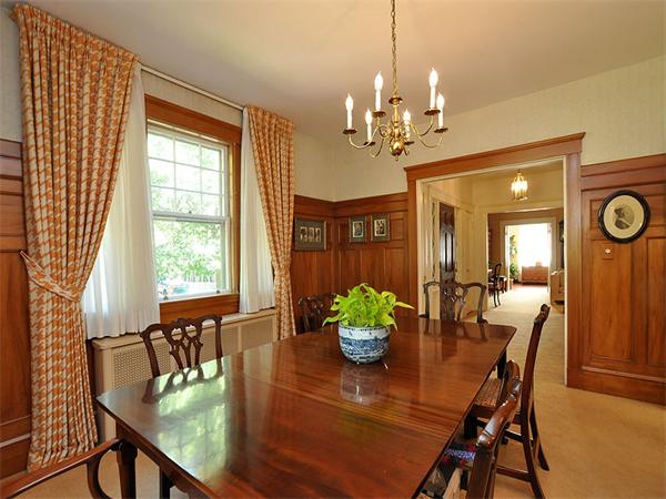 14 Amory Street Brookline, MA 02446 - Photo 8 of 25 a dining room with furniture potted plants and wooden floor