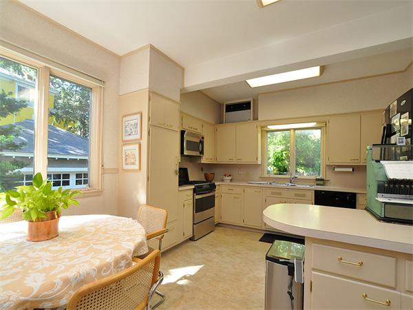 14 Amory Street Brookline, MA 02446 - Photo 9 of 25 a kitchen with a stove a sink and a refrigerator