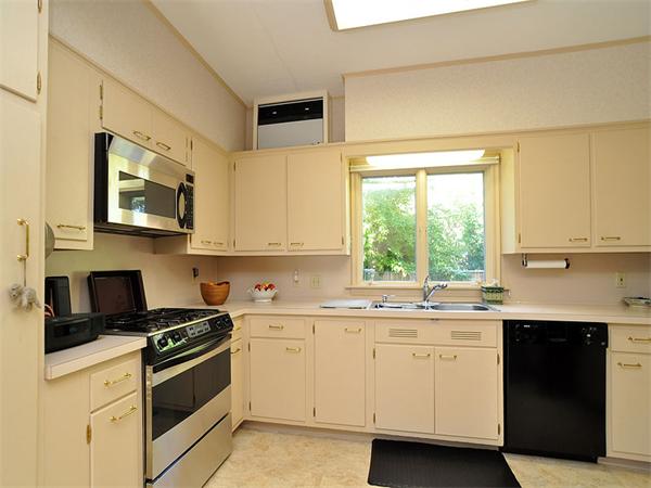 14 Amory Street Brookline, MA 02446 - Photo 10 of 25 a kitchen with a sink stove and microwave