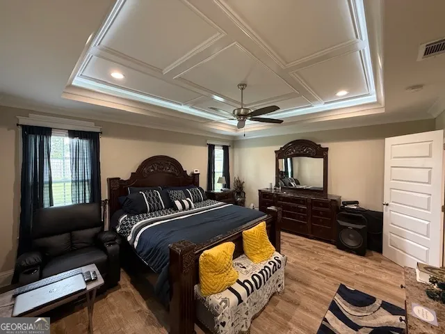 a bedroom with furniture and a mirror